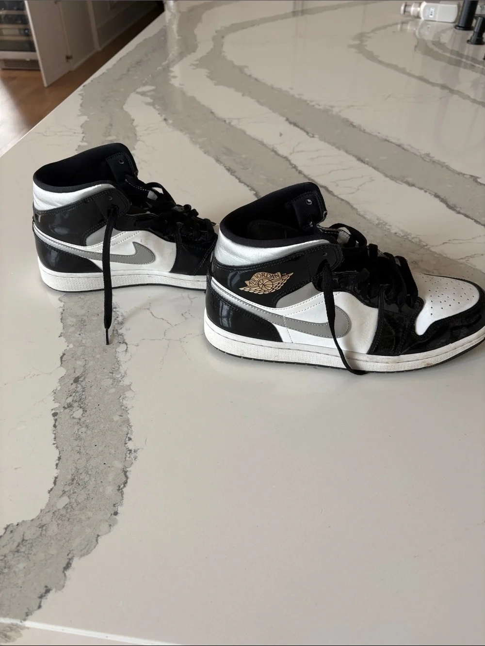 Like new Nike Black patent, silver and White Mid AirJordan